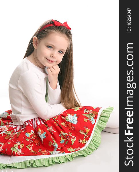 Adorable preschool girl wearing a Christmas holiday outfit posing, isolated on white. Adorable preschool girl wearing a Christmas holiday outfit posing, isolated on white