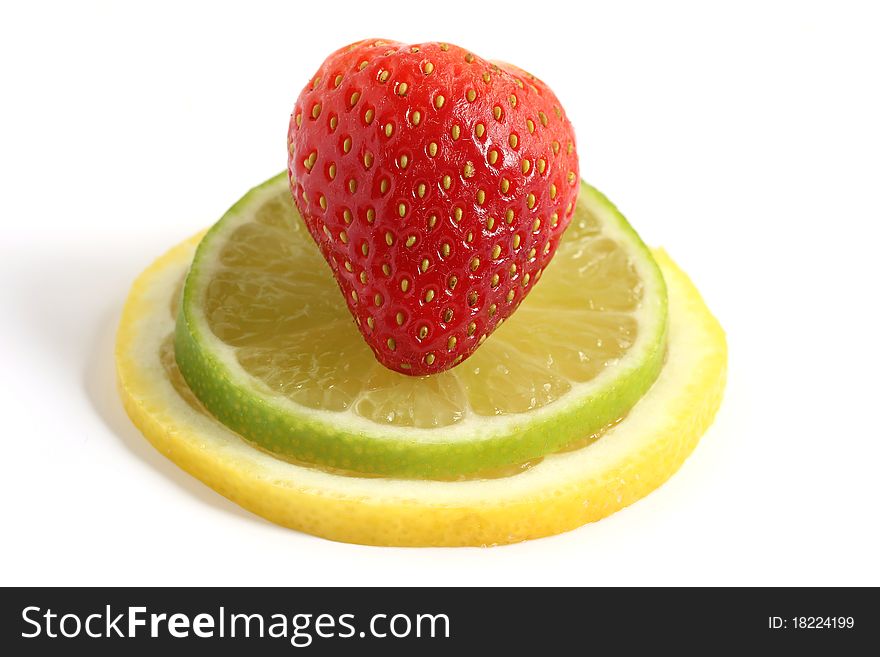 Strawberry on lemon and lime fruit slices isolated on white background. Strawberry on lemon and lime fruit slices isolated on white background