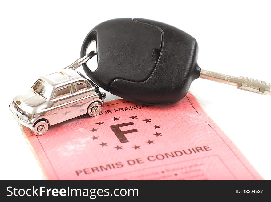 Key car with little key ring in car's shape isolated on white background