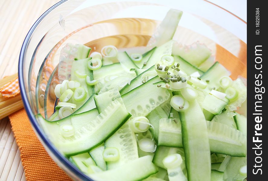 Fresh salad oo cucumbers with springonions in a bowl. Fresh salad oo cucumbers with springonions in a bowl