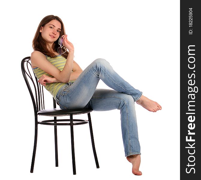 Girl in green stripy top sit on stool.