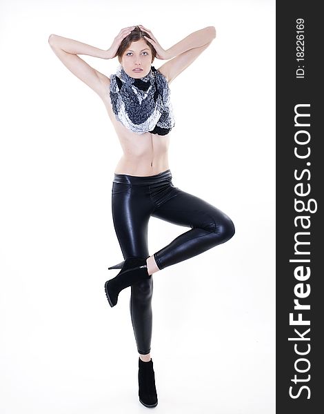 Fashion model posing in leggings and a scarf on a white background