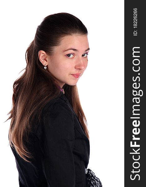 Girl in black suit posing side-view. Isolated on white.