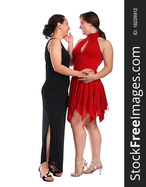 Two girls in dresses posing isolated