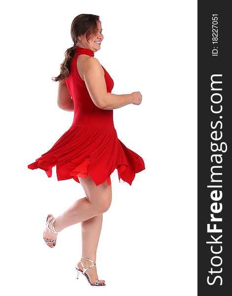 Chubby girl in red dress dancing isolated