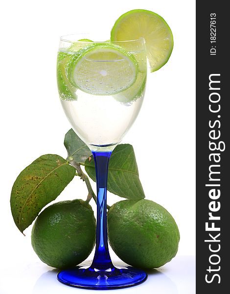 Fresh lime water glass with lime isolated on white background.