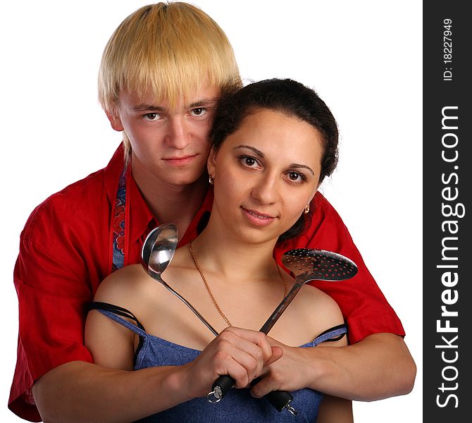 Young man and woman embraces with utensil. Isolated.