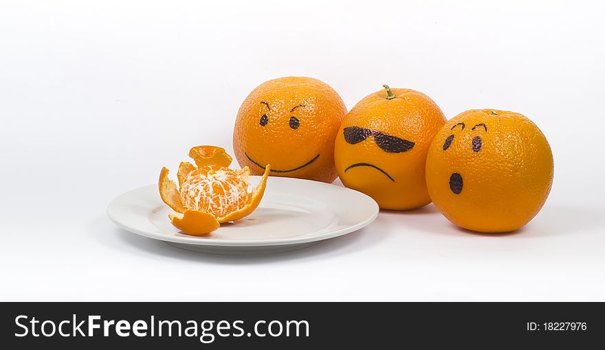 Oranges, tangerines on a plate on a white background