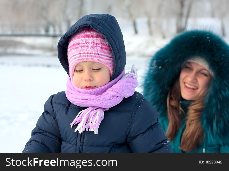 Mother And  Kid Having Fun Outdoors On  Winter Day
