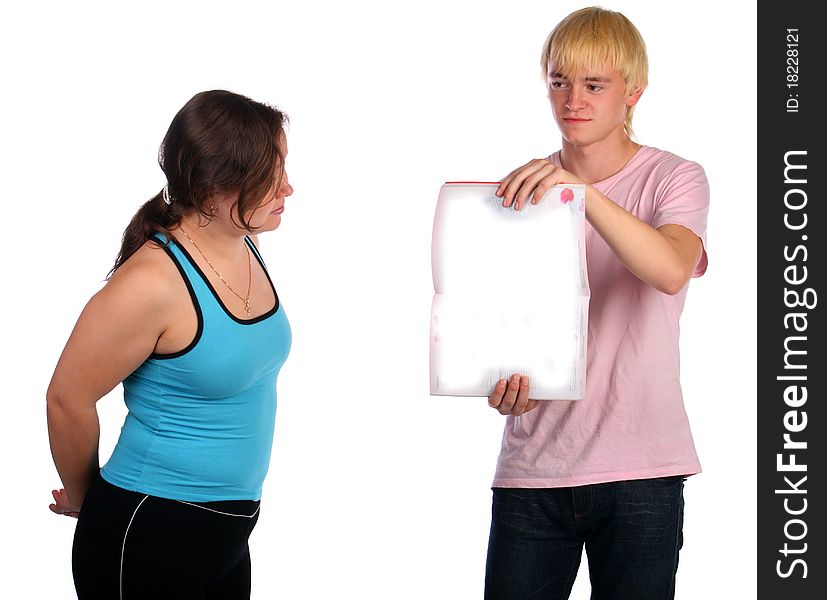 Young man shows blank psges for girl. Isolated.