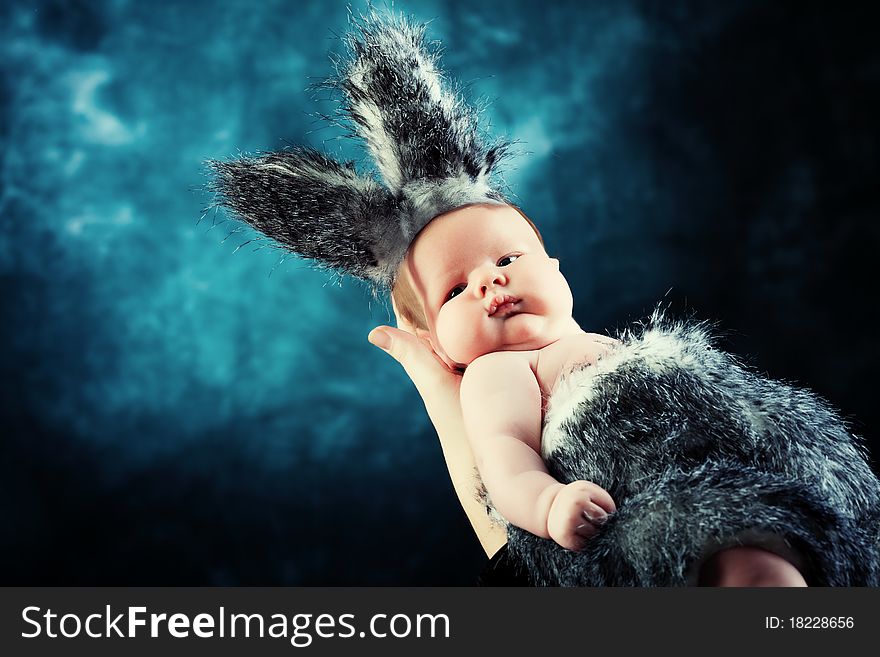 Portrait of a beautiful baby in rabbit costume. Portrait of a beautiful baby in rabbit costume.