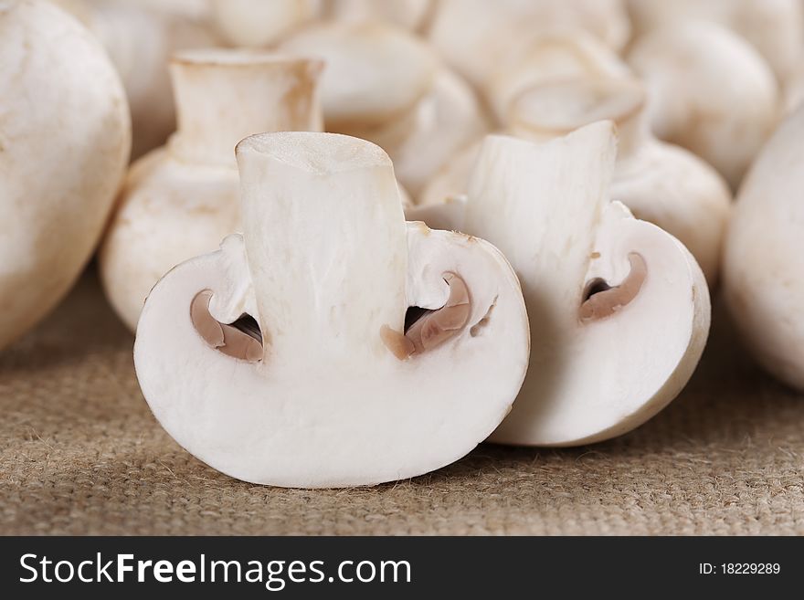 Fresh mushrooms champignon on burlap