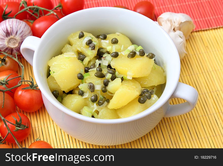 A fresh salad of potatoes with onions and capers