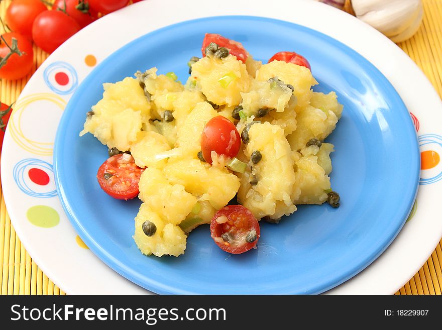 A fresh salad of potatoes with tomatoes and capers