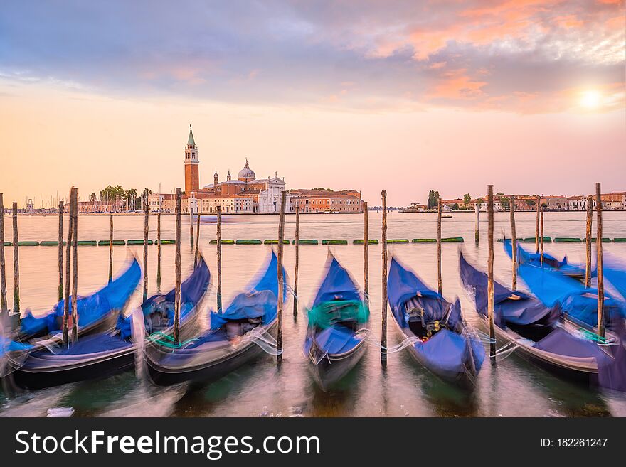 Cityscape image of Venice, in Italy during sunrise with Gondolas. Cityscape image of Venice, in Italy during sunrise with Gondolas