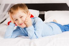 Boy Lies On A Bed In A Comfortable Situation Stock Images Boy Lies On A Bed In A Comfortable Situation Stock Images