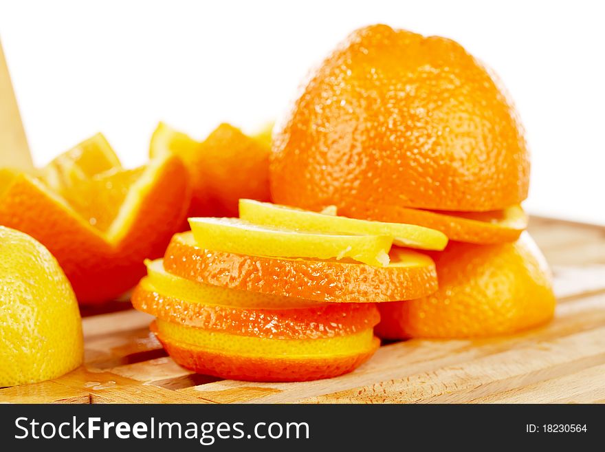 Slices of on orange and lemon mixed together. Slices of on orange and lemon mixed together