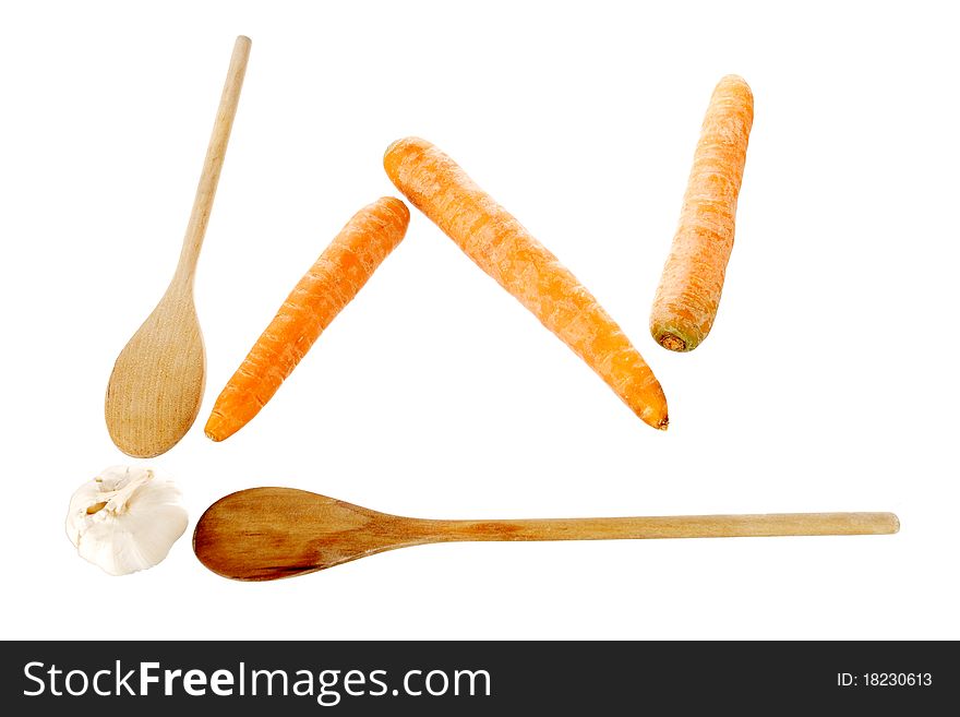 Ladles, carrots and garlik on a white background making a chart shape, with clipping path. Ladles, carrots and garlik on a white background making a chart shape, with clipping path