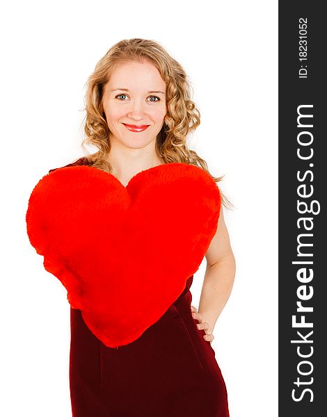 Charming young woman with a red heart on a white background