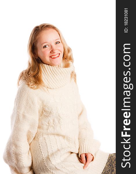Charming beautiful young woman in a sweater on a white background
