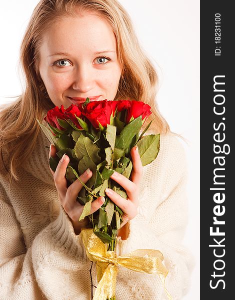 Woman with the bouquet of red roses