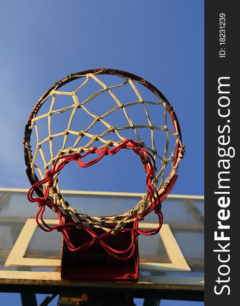 Basketball hook with blue sky in outdoor field