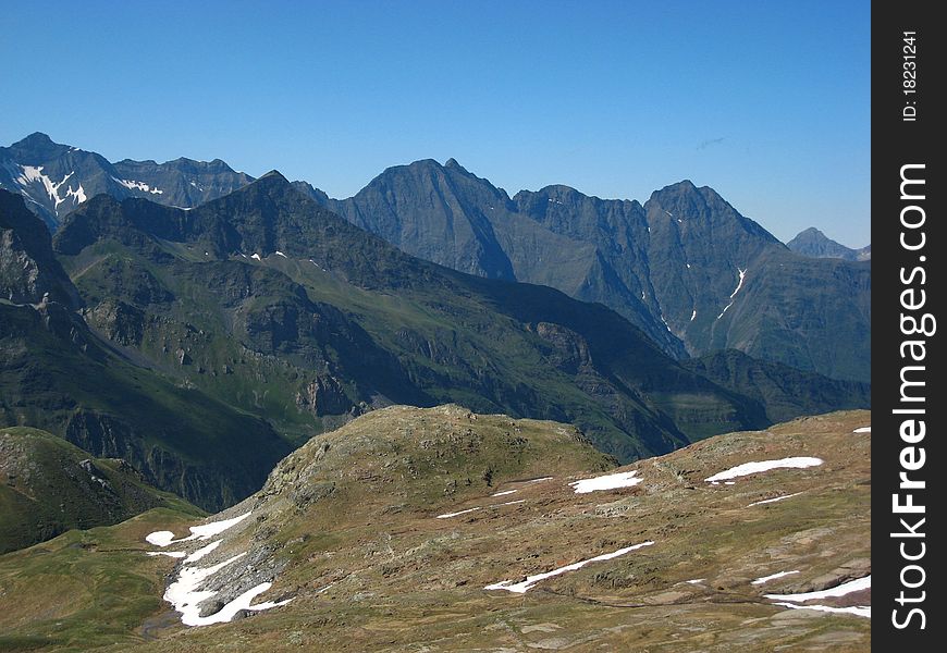 Sharp peaks of high rocky black mountains. Sharp peaks of high rocky black mountains