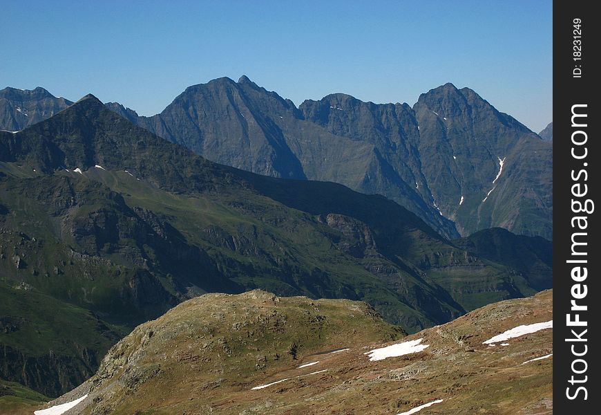 Sharp peaks of high rocky black mountains. Sharp peaks of high rocky black mountains