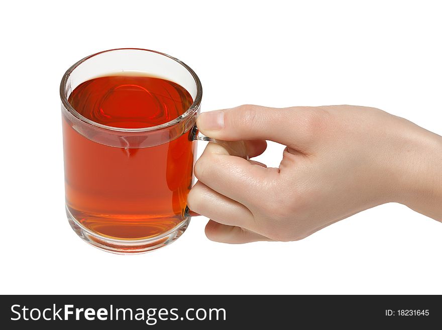 The cup of tea in female hand. Isolated on white background. The cup of tea in female hand. Isolated on white background.