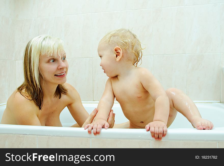 Mother and her son in the bathroom. Mother and her son in the bathroom