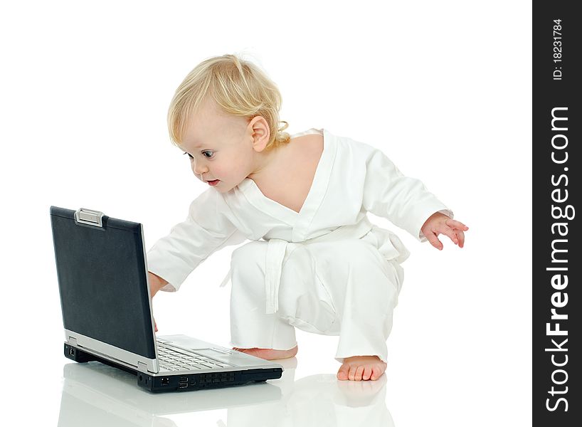 Little boy in kimono about laptop on white background. Little boy in kimono about laptop on white background