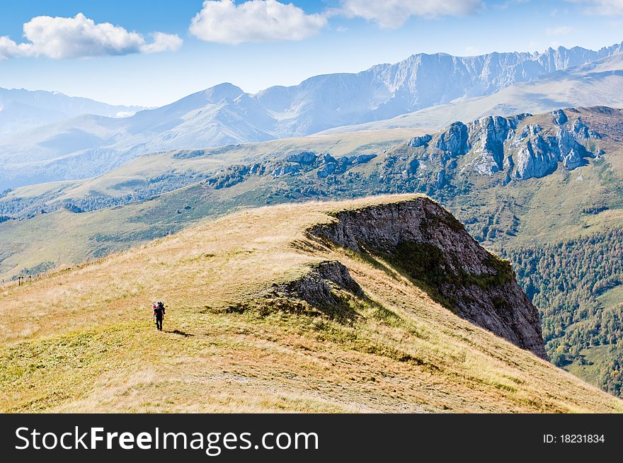 Man hiking in mountain with backpack