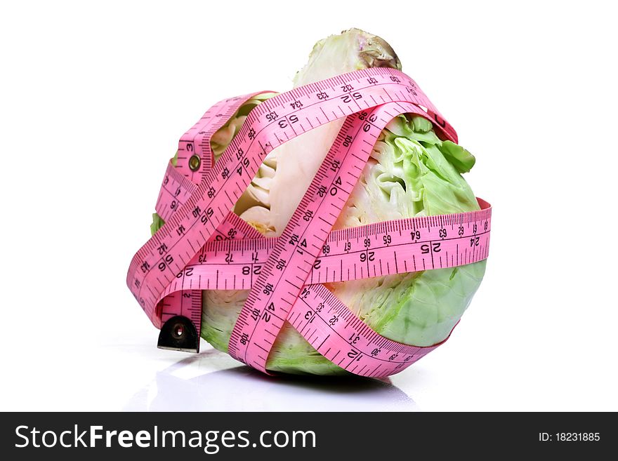 Cabbage wrapped in measuring tape isolated on white background. Cabbage wrapped in measuring tape isolated on white background.