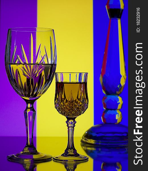 Wine glasses on bright colorful striped background. Wine glasses on bright colorful striped background