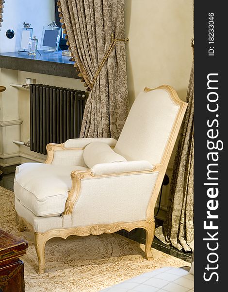 Old Styled armchair near the window