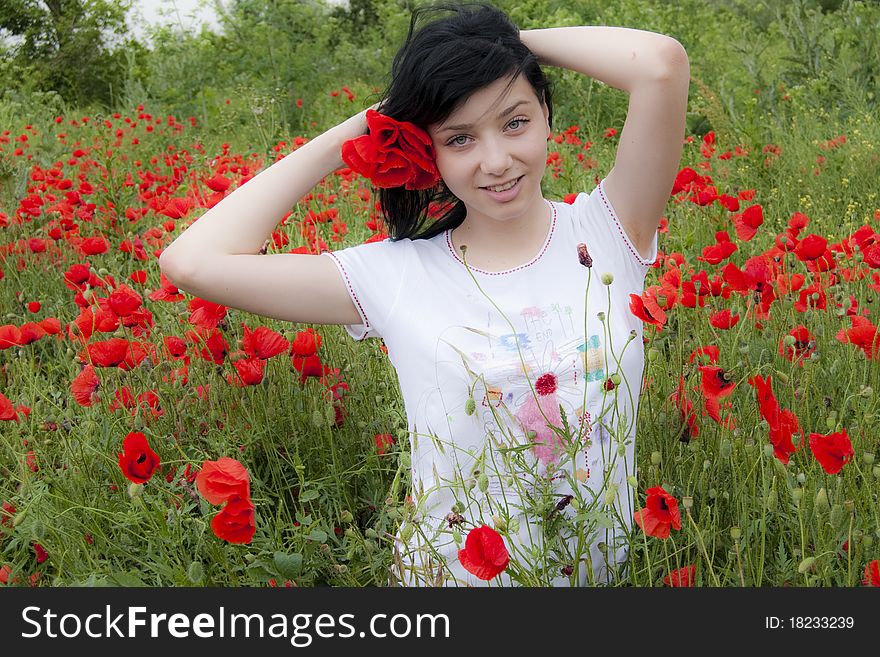 Young Black Hair Girl in red poppies field