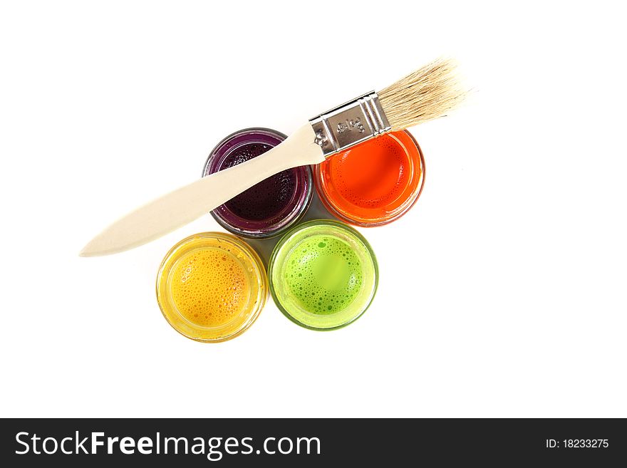 Colorful paint buckets with paintbrush on white background