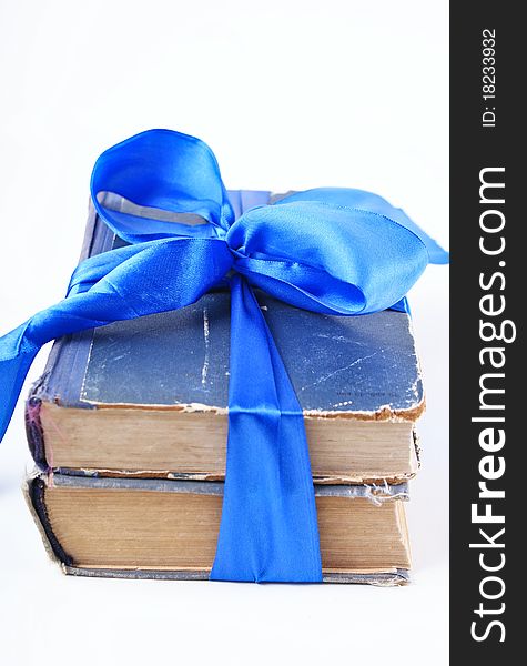 Old books with blue bow. Old books with blue bow