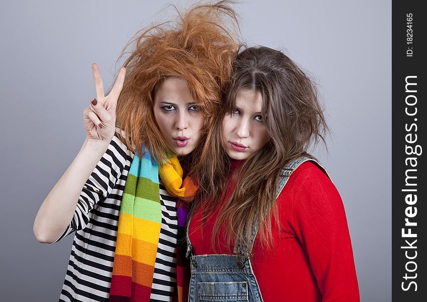 Two funny girls. Studio shot.