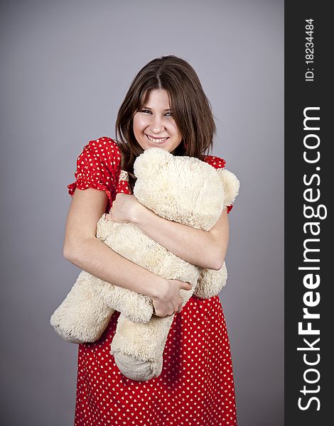 Funny girl with teddy bear. Studio shot.