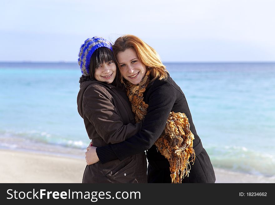 Two girls at beach. Outdoor shot.