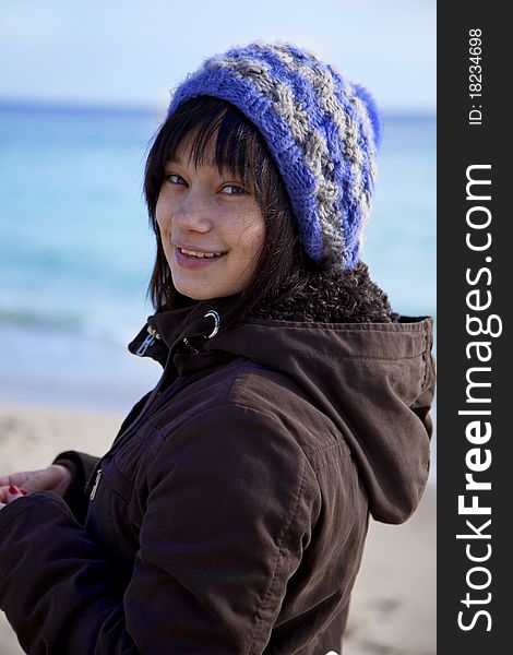 Funny girl at the beach. Outdoor shot.