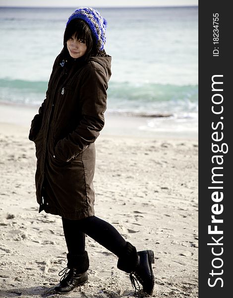 Funny girl at the beach. Outdoor shot.