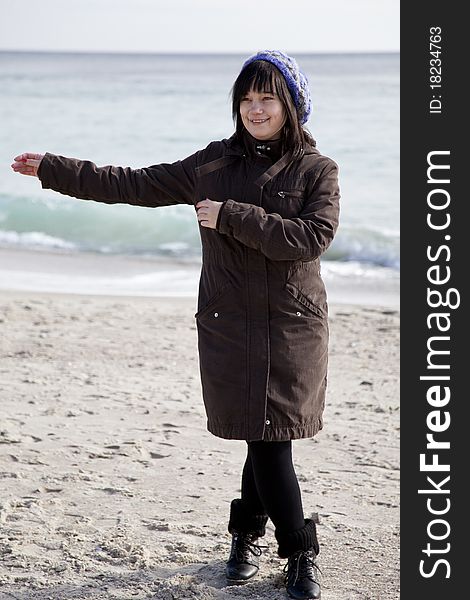 Funny girl at the beach. Outdoor shot.