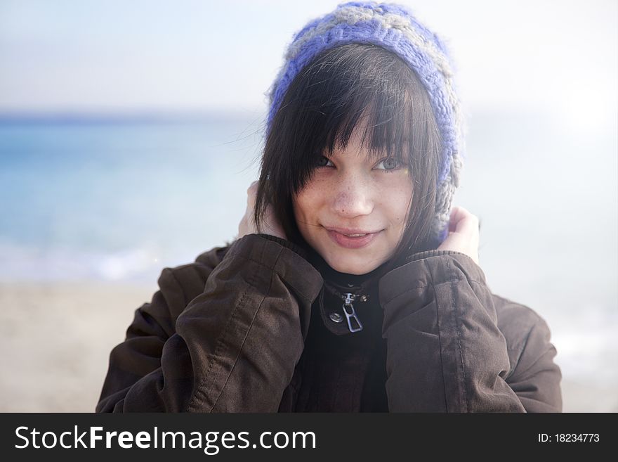 Funny girl at the beach. Outdoor shot.