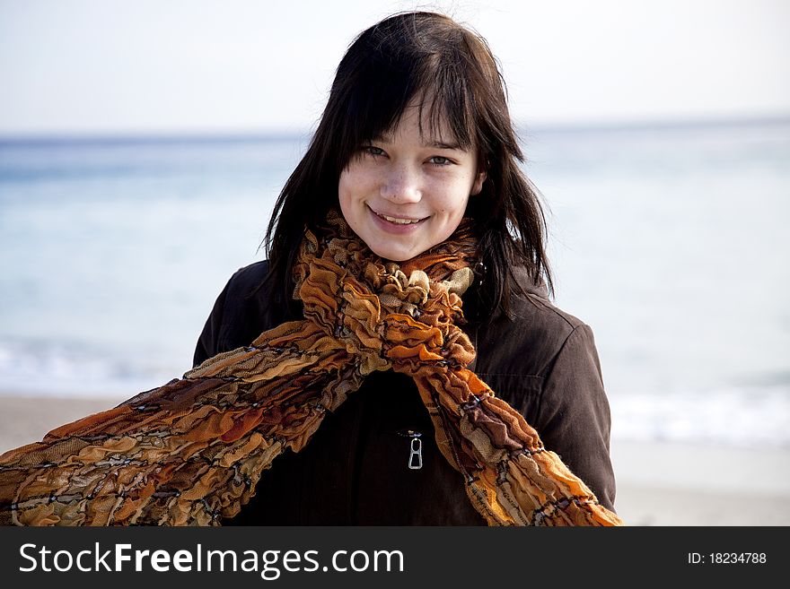 Funny girl at the beach. Outdoor shot.