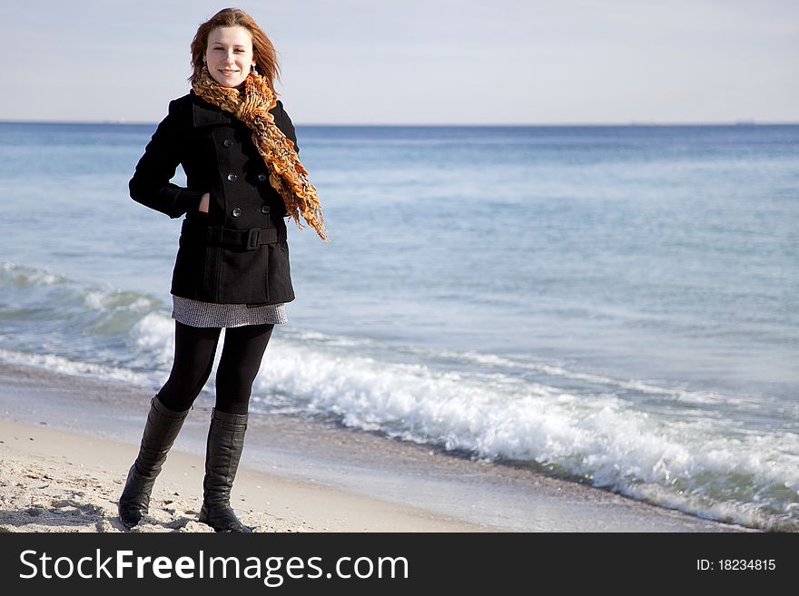 Red-haired girl at the beach.