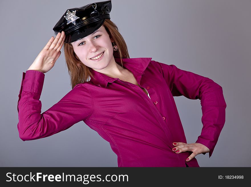 Girl in cap. Studio shot.