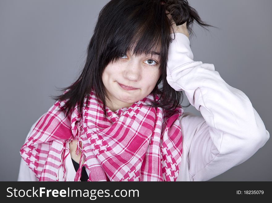 Funny girl in red scarf. Studio shot.