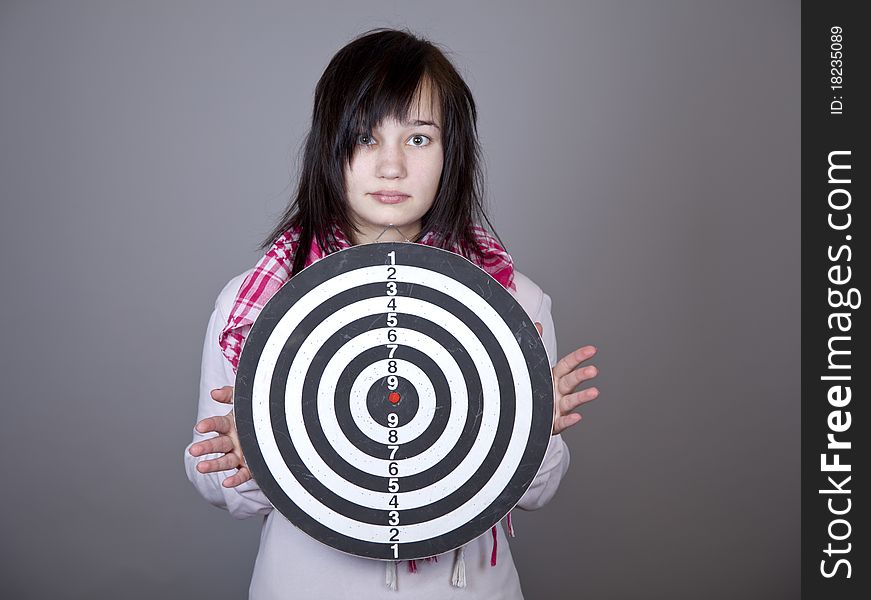 Girl with darts. Studio shot.